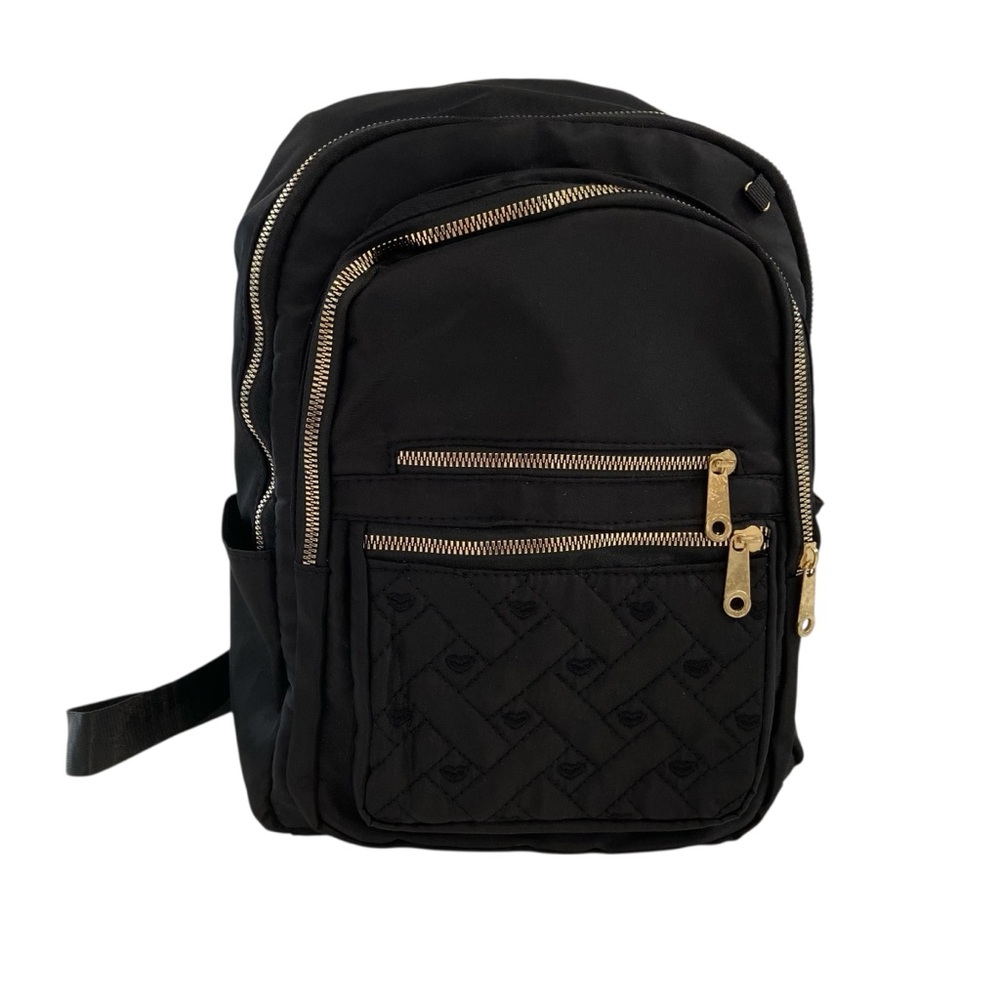 Sleek black quilted backpack with gold zipper accents versatile daily bag